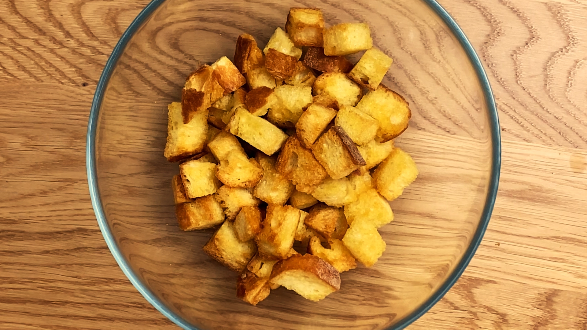 Golden, crispy air fryer croutons made from cubed bread, lightly seasoned and toasted.