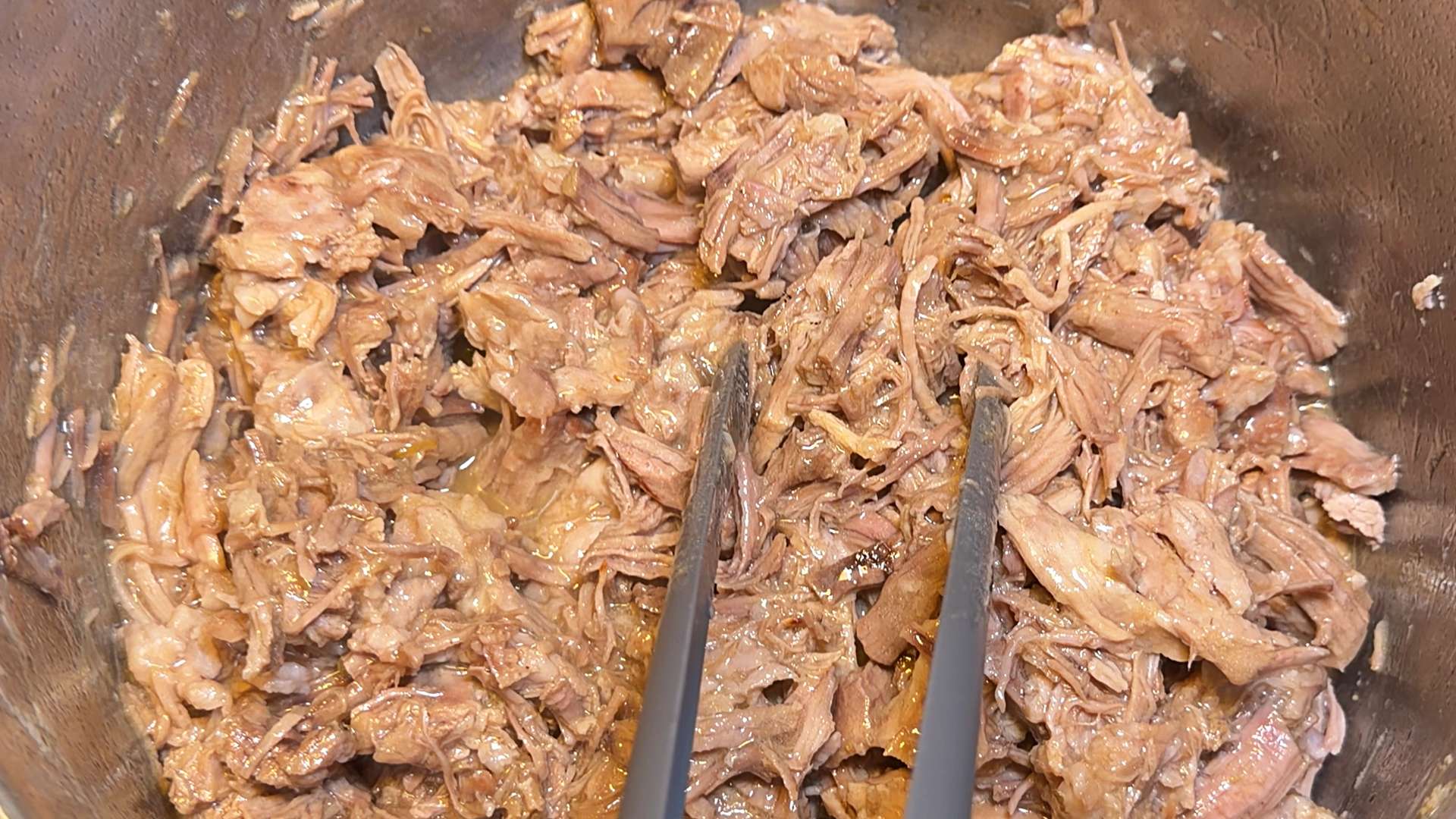 Juicy, melt-in-your-mouth pulled pork meat for homemade carnitas tacos.