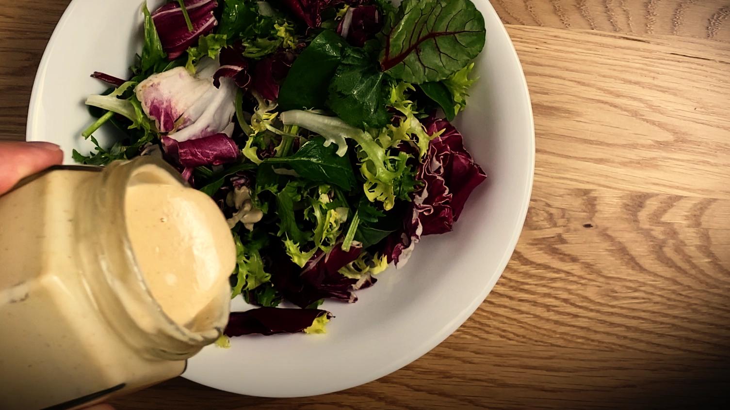 Smooth tahini dressing for salads – easy vegan recipe.